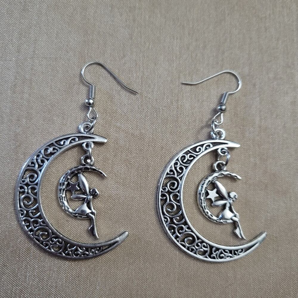 Fairy sitting on moon silver tone filigree earrings